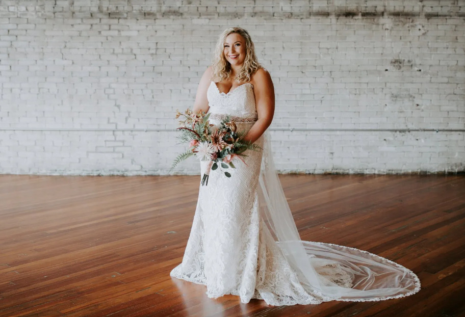 bride poses for photo