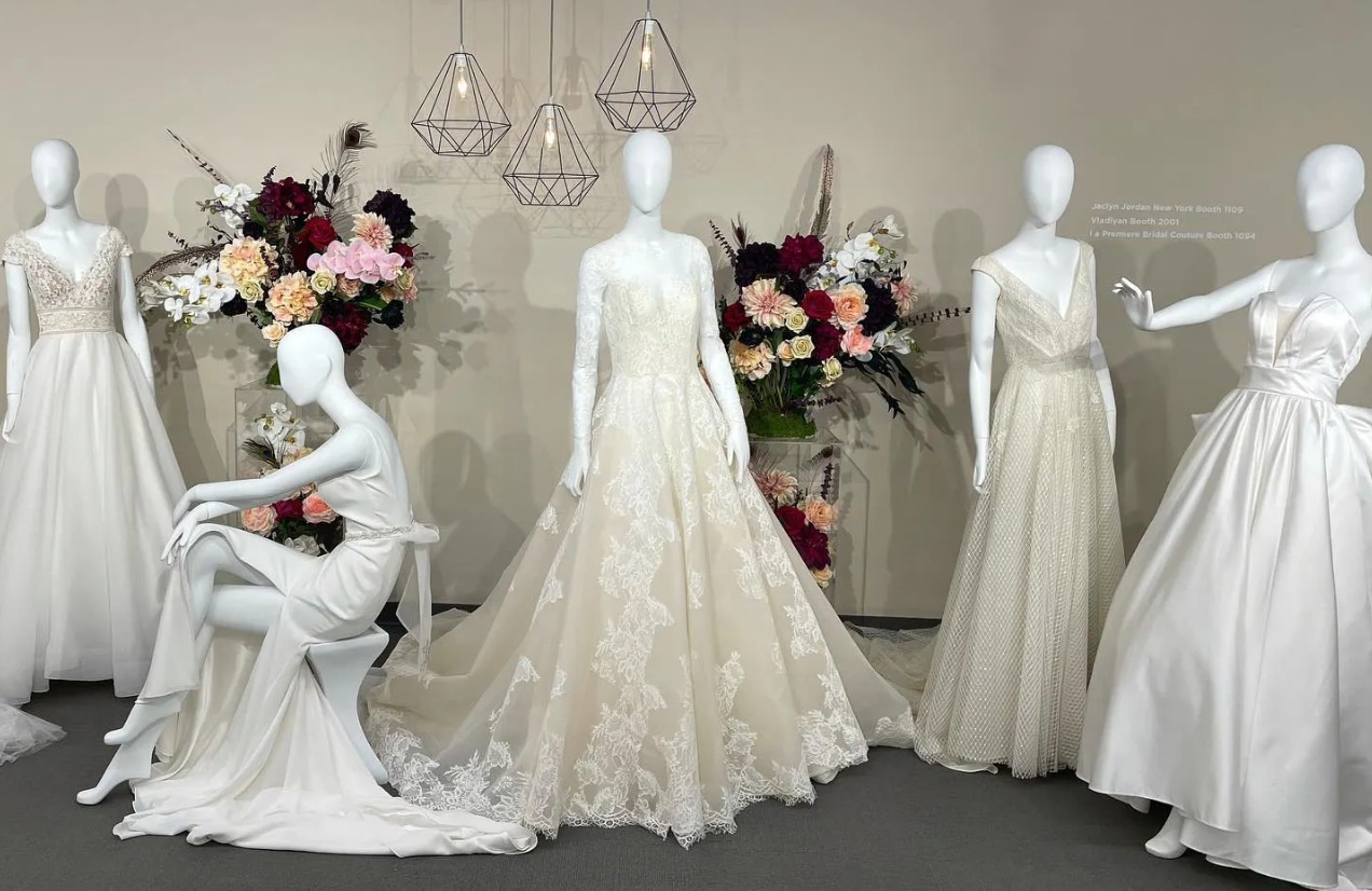 Mannequins pose in elegant wedding dresses.