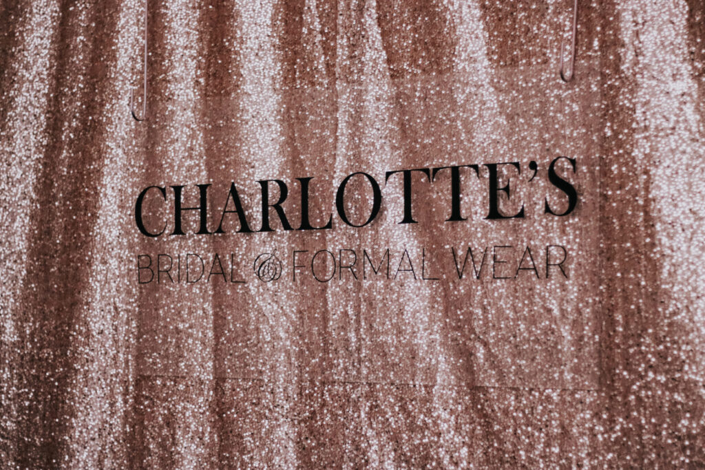 Charlotte's logo on sparkle curtain